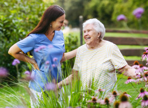 aide and senior woman having a conversation