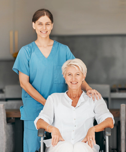 aide and senior woman smiling