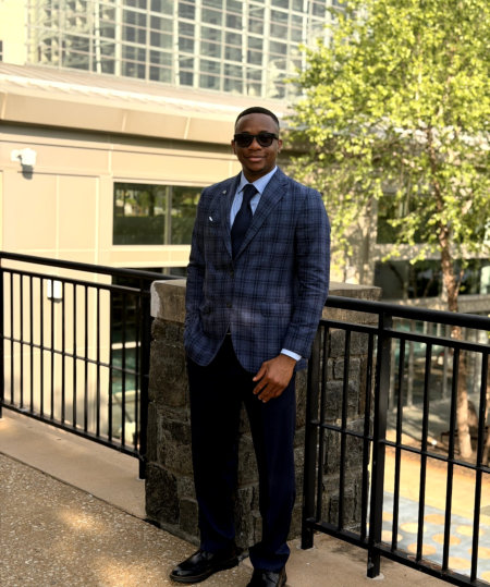 man in formal attire having a photo
