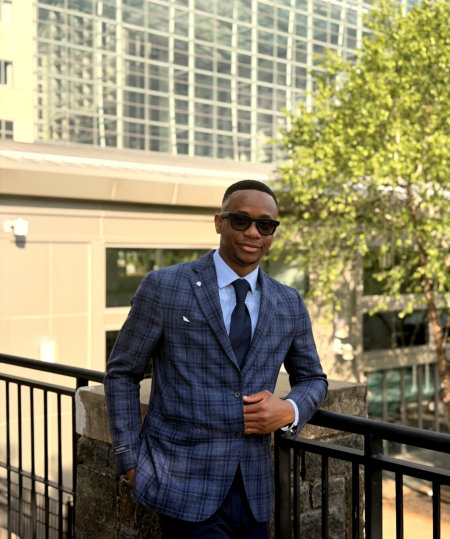 man in formal attire having a pose