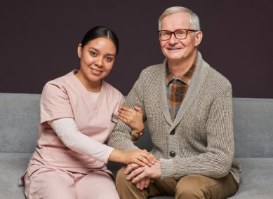 aide holding the senior man