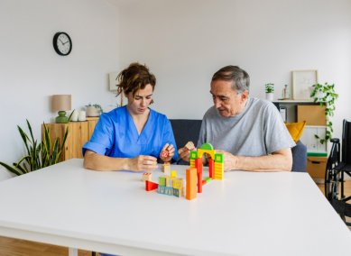 aide and senior woman having an activity